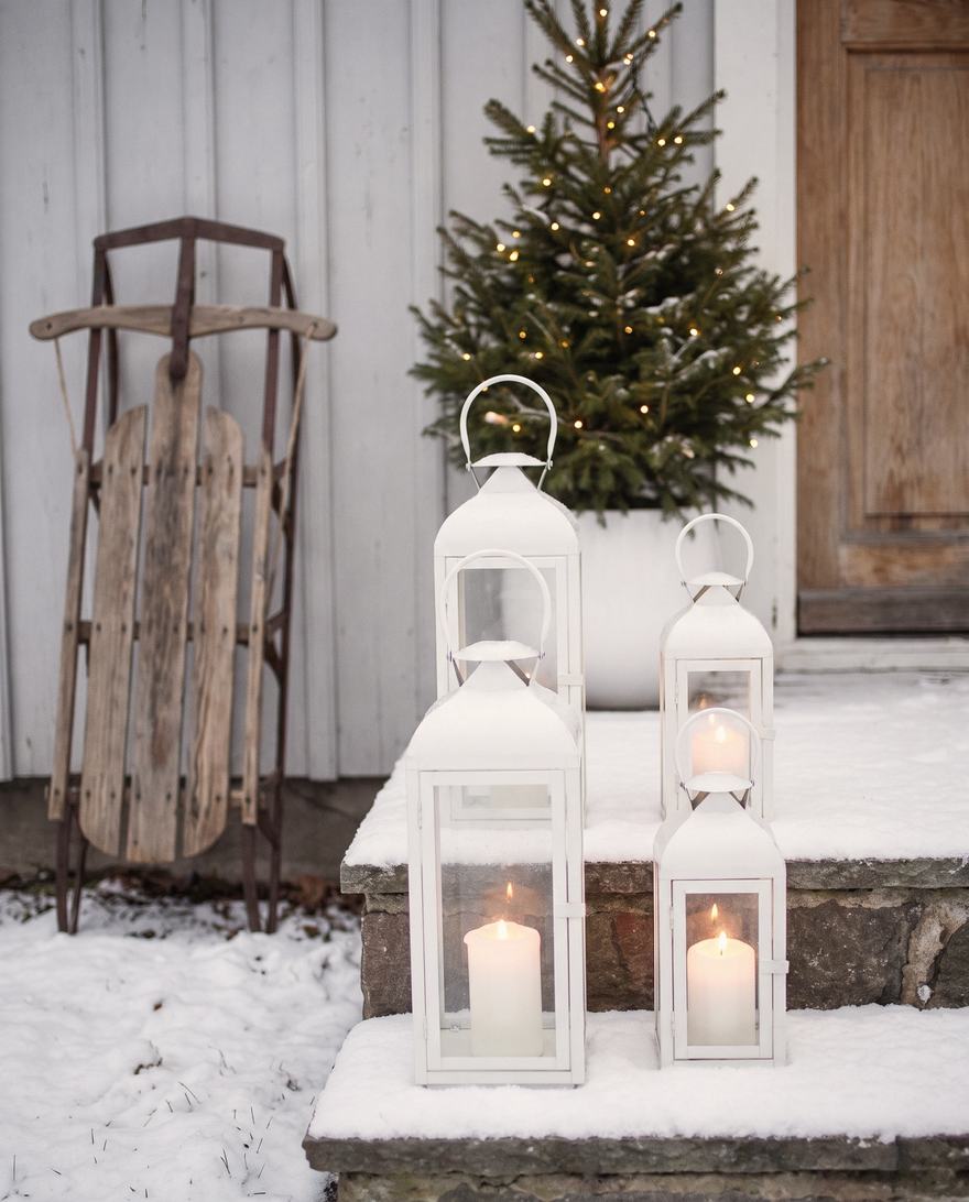 Three white lanterns and the sled.