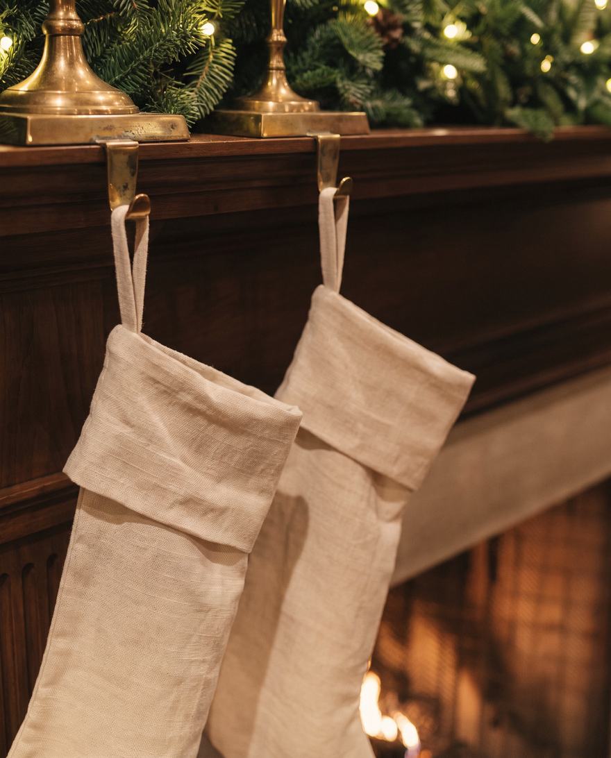 Linen stockings on brass holders.